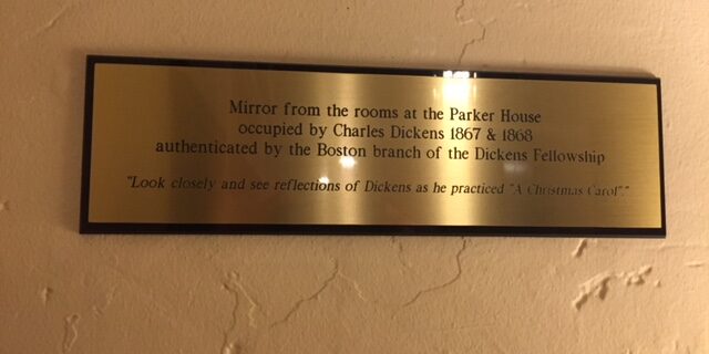 Plaque giving details about Charles Dickens mirror